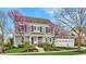 Charming two-story home with a well-manicured lawn, blooming trees, and a three-car garage at 7613 W Stonegate Dr, Zionsville, IN 46077
