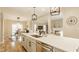 Spacious kitchen with an island featuring a dishwasher and stainless steel sink at 7613 W Stonegate Dr, Zionsville, IN 46077
