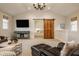 Spacious living room features a sliding barn door and a view into a cozy bedroom at 7613 W Stonegate Dr, Zionsville, IN 46077