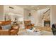 Spacious living area showcasing leather chairs, open concept, and views of the staircase at 7613 W Stonegate Dr, Zionsville, IN 46077