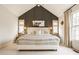 Vaulted main bedroom with decorative touches and an en-suite bath provides a tranquil and stylish retreat at 7613 W Stonegate Dr, Zionsville, IN 46077