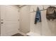Welcoming mudroom with a coat rack, jacket, and a backpack hanging, offering practical storage and organization at 7613 W Stonegate Dr, Zionsville, IN 46077