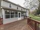 The expansive back deck is stained brown and offers scenic views of the home's big backyard at 8160 Bold Forbes Ct, Indianapolis, IN 46217