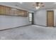 Large bedroom featuring carpeted floors, a ceiling fan with lights, and plenty of cabinet space at 8160 Bold Forbes Ct, Indianapolis, IN 46217