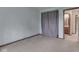 Bedroom with neutral carpet, light blue walls and a door to an attached bathroom at 8160 Bold Forbes Ct, Indianapolis, IN 46217