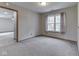 Cozy bedroom with neutral carpet, natural light and view to next room at 8160 Bold Forbes Ct, Indianapolis, IN 46217