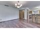 Dining Room featuring hardwood floors, view to Kitchen, and hanging light fixture at 8160 Bold Forbes Ct, Indianapolis, IN 46217