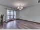 Dining room with hard wood floors, large window and hanging light fixture at 8160 Bold Forbes Ct, Indianapolis, IN 46217