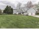 Well-kept two-story home with attached two-car garage and expansive green lawn at 8160 Bold Forbes Ct, Indianapolis, IN 46217