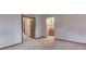 Hallway with open doorways leading to a well lit bath and bedroom at 8160 Bold Forbes Ct, Indianapolis, IN 46217