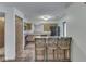 Eat-in kitchen featuring breakfast bar, wooden cabinets and black appliances at 8160 Bold Forbes Ct, Indianapolis, IN 46217