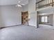 Spacious living room with high ceilings, built-in shelving, and plush carpeting at 8160 Bold Forbes Ct, Indianapolis, IN 46217