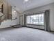 Open living room featuring large window, and comfortable carpeting, perfect for entertaining at 8160 Bold Forbes Ct, Indianapolis, IN 46217