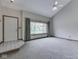 Bright living room with vaulted ceilings, large windows, and cozy carpeting at 8160 Bold Forbes Ct, Indianapolis, IN 46217