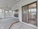 Spacious sunroom with sliding doors, windows, ceiling fan and access to outdoor area at 8160 Bold Forbes Ct, Indianapolis, IN 46217