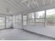 Bright sunroom featuring multiple windows, a lattice ceiling, and a ceiling fan at 8160 Bold Forbes Ct, Indianapolis, IN 46217