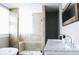 Luxurious bathroom with a walk-in shower, double vanity, and modern fixtures at 827 Dawson St, Indianapolis, IN 46203