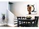 Stylish dining area with contemporary decor, including modern art and a chic bar cart at 827 Dawson St, Indianapolis, IN 46203