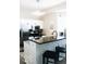 Stylish kitchen featuring stainless steel appliances, sleek black countertops, and modern lighting at 827 Dawson St, Indianapolis, IN 46203