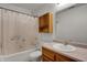 Bathroom with shower and tub combination and a wood vanity at 8312 Eagles Nest Dr, Avon, IN 46123