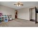 Neutral bedroom with a play kitchen and direct access to the kitchen at 8312 Eagles Nest Dr, Avon, IN 46123