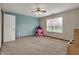 Neutral bedroom with a blue accent wall featuring a princess tent at 8312 Eagles Nest Dr, Avon, IN 46123