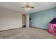 Neutral bedroom featuring a blue accent wall and a princess tent at 8312 Eagles Nest Dr, Avon, IN 46123