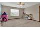 Spacious neutral bedroom featuring a window, play kitchen, and a princess tent at 8312 Eagles Nest Dr, Avon, IN 46123
