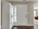Bright entryway featuring a white front door, a side window, and dark wood flooring at 8312 Eagles Nest Dr, Avon, IN 46123
