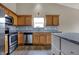 Bright kitchen featuring stainless steel appliances and wood cabinets at 8312 Eagles Nest Dr, Avon, IN 46123