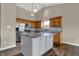 Bright kitchen with stainless steel appliances and a gray island at 8312 Eagles Nest Dr, Avon, IN 46123