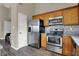 Kitchen area with stainless steel appliances and wood cabinets at 8312 Eagles Nest Dr, Avon, IN 46123