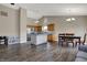 Open concept living room with wood floors, kitchen, and dining area at 8312 Eagles Nest Dr, Avon, IN 46123