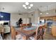 Open living and dining area featuring hardwood floors and an island with granite countertops at 8312 Eagles Nest Dr, Avon, IN 46123