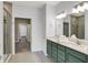 Bathroom with dual sinks, a large mirror, and a glass-enclosed shower at 8570 Hudson Way, Brownsburg, IN 46112