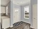 Inviting entryway featuring wood-look flooring, a stylish rug, and a bright, welcoming atmosphere at 8570 Hudson Way, Brownsburg, IN 46112