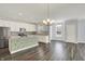 Modern kitchen featuring stainless steel appliances, a center island with seating, and abundant natural light at 8570 Hudson Way, Brownsburg, IN 46112