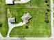 Bird's eye view of meticulously maintained home featuring verdant lawn, additional outbuilding and fenced property lines at 8890 N Pennington Rd, Mooresville, IN 46158