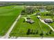 Expansive aerial view of a secluded home with lush green lawns, outbuildings, and mature trees on a beautiful lot at 8890 N Pennington Rd, Mooresville, IN 46158