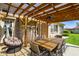 Covered patio with a beautiful wooden table and chairs at 8890 N Pennington Rd, Mooresville, IN 46158