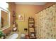 Cozy bathroom with vanity, mirror, and patterned shower curtain at 8890 N Pennington Rd, Mooresville, IN 46158