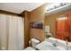 Bathroom featuring a vanity with a white countertop and a shower/tub combo with a curtain at 8890 N Pennington Rd, Mooresville, IN 46158
