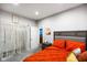 Cozy bedroom with a gray bed frame, bright bedding, and a trendy macrame wall hanging at 8890 N Pennington Rd, Mooresville, IN 46158