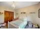 Bright bedroom features a chandelier, white furniture, and princess-themed decorations at 8890 N Pennington Rd, Mooresville, IN 46158