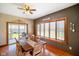 Inviting dining room with ample natural light, a large wooden table, and stylish decor at 8890 N Pennington Rd, Mooresville, IN 46158