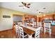 Bright dining room with wood floors, large table, and open layout at 8890 N Pennington Rd, Mooresville, IN 46158