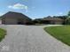 Spacious gravel driveway connects two buildings, offering ample parking and a rustic aesthetic at 8890 N Pennington Rd, Mooresville, IN 46158