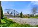 Attractive entry gate flanked by manicured landscaping with a gravel drive leading into the property at 8890 N Pennington Rd, Mooresville, IN 46158