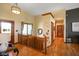 Well-lit foyer with hardwood floors and wood trim at 8890 N Pennington Rd, Mooresville, IN 46158