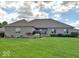 Well-maintained home showcases lush green lawn and manicured landscaping, enhancing curb appeal at 8890 N Pennington Rd, Mooresville, IN 46158